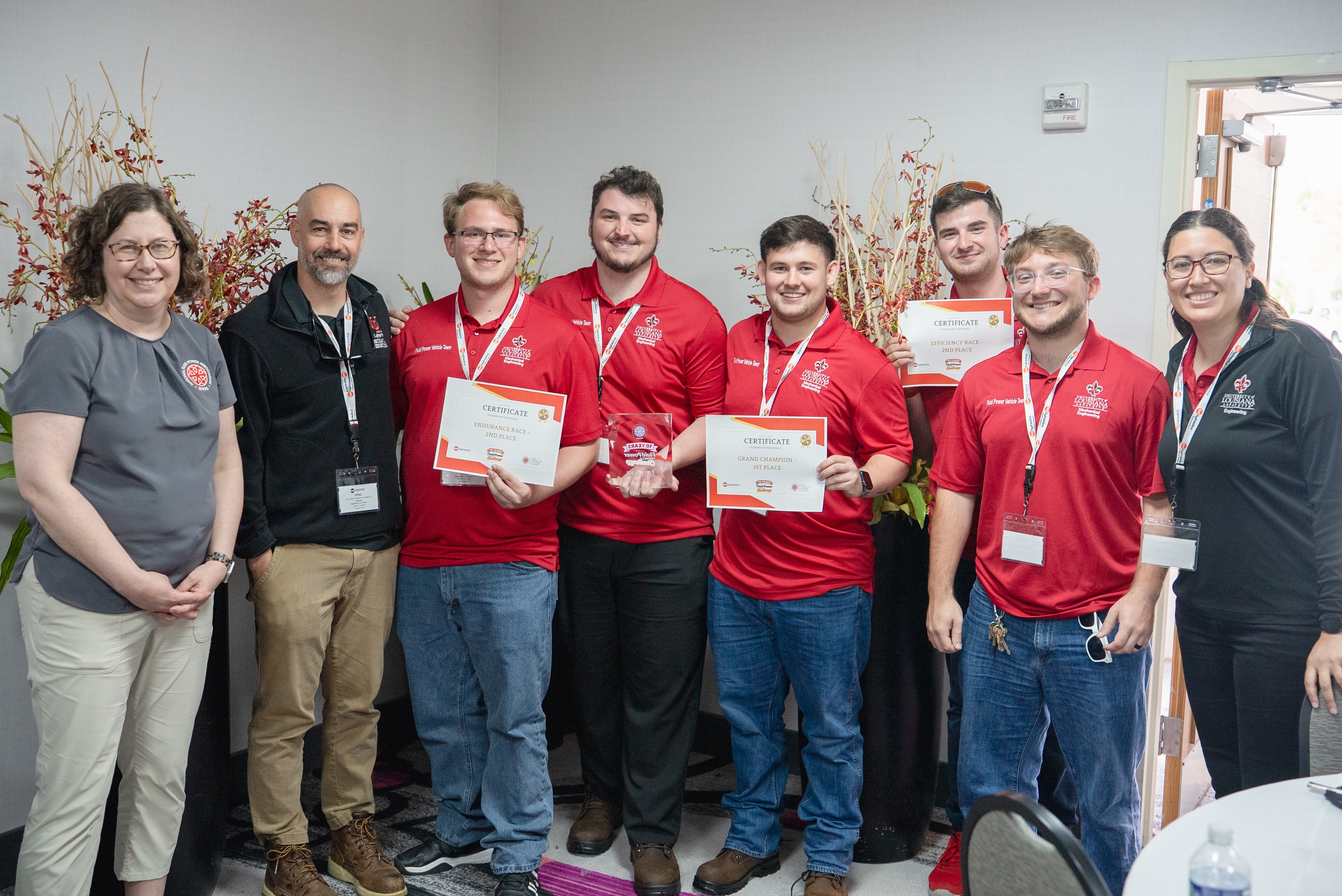 Pictured left to right: Mary Pluta, Workforce Program Manager for the National Fluid Power Association; John Carrol, MCHE Faculty Advisor; Jude Meaux; Brendan Oalmann; Kaiden Romein; Logan Power; Andrew Judice; Yasmeen Qudsi MCHE Faculty Advisor