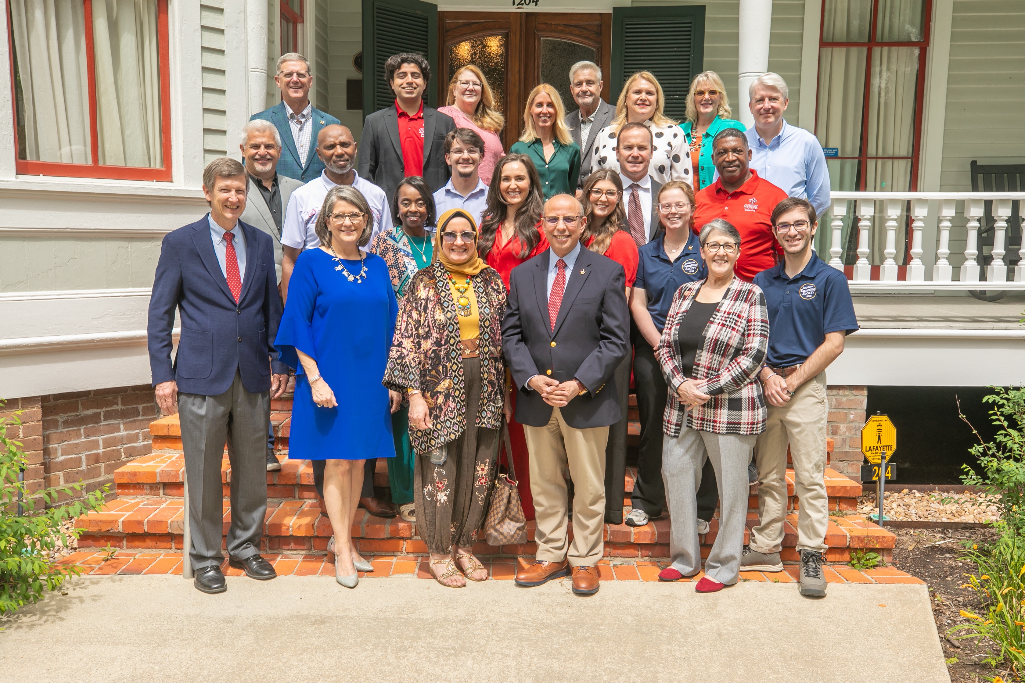Group picture on the steps of the Roy House with DAC Members, Dean Ahmed Khattab, First Lady Eman Matter along with other guests attending the brunch.