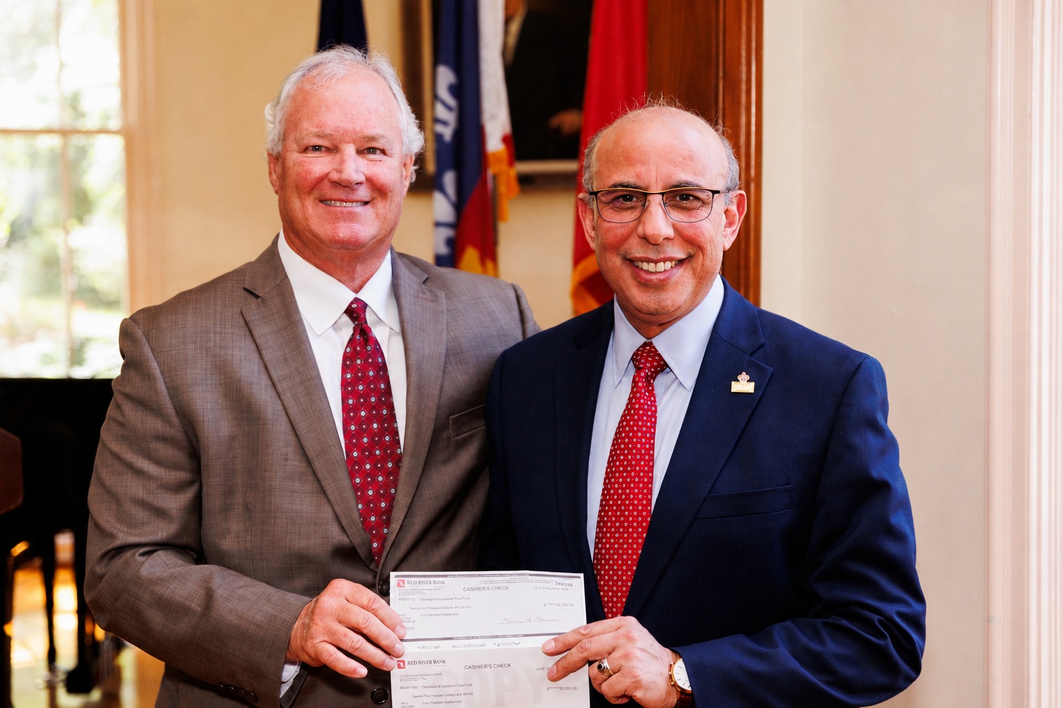 Ken Naquin, Louisiana Construction Education Foundation and Ahmed Khattab, Dean of Engineering holding the check presentated to the College
